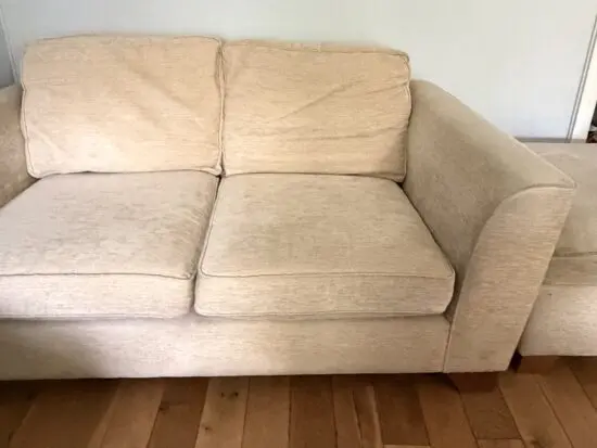 2 x beige 2 seater sofas with ottoman pouffe