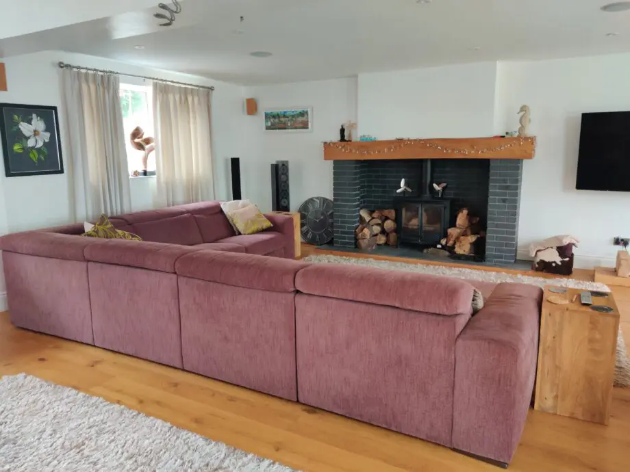 Natuzzi large corner Clyde sofa maroon fabric with foot rests