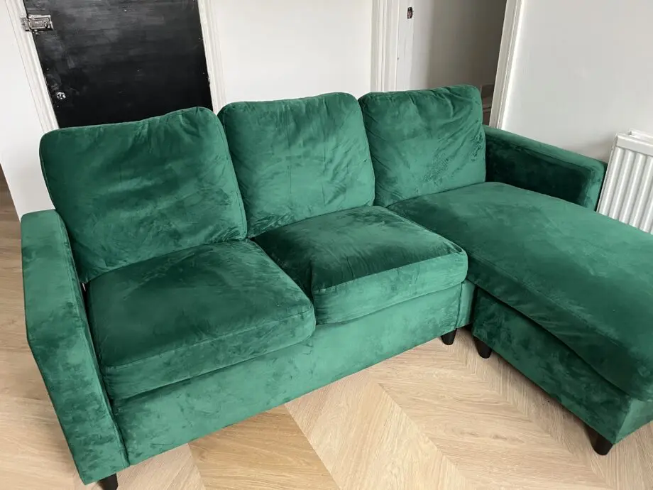 Daals three seater green velvet chaise sofa