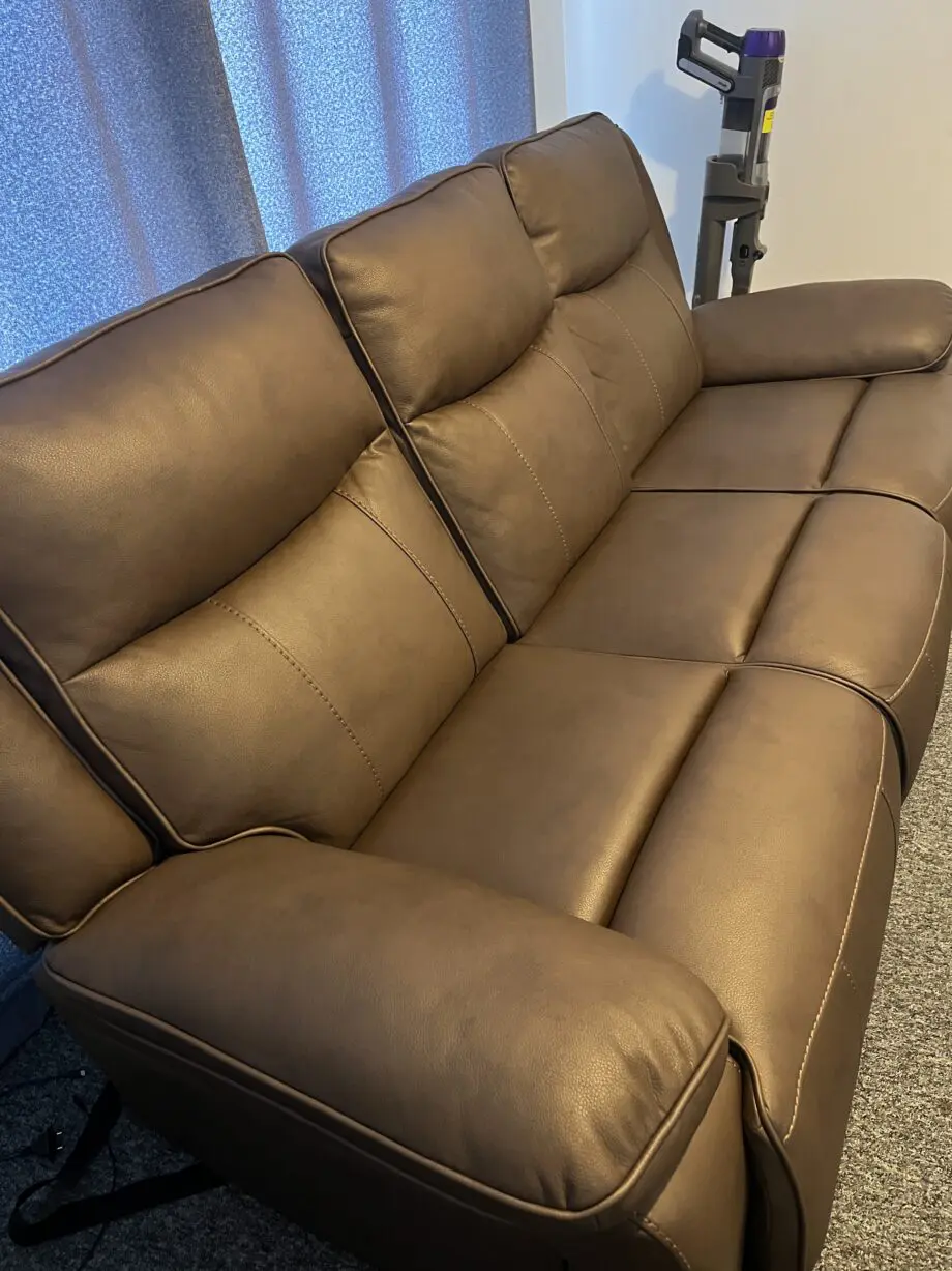 Near new 3 seater manual recliner: brown leather.