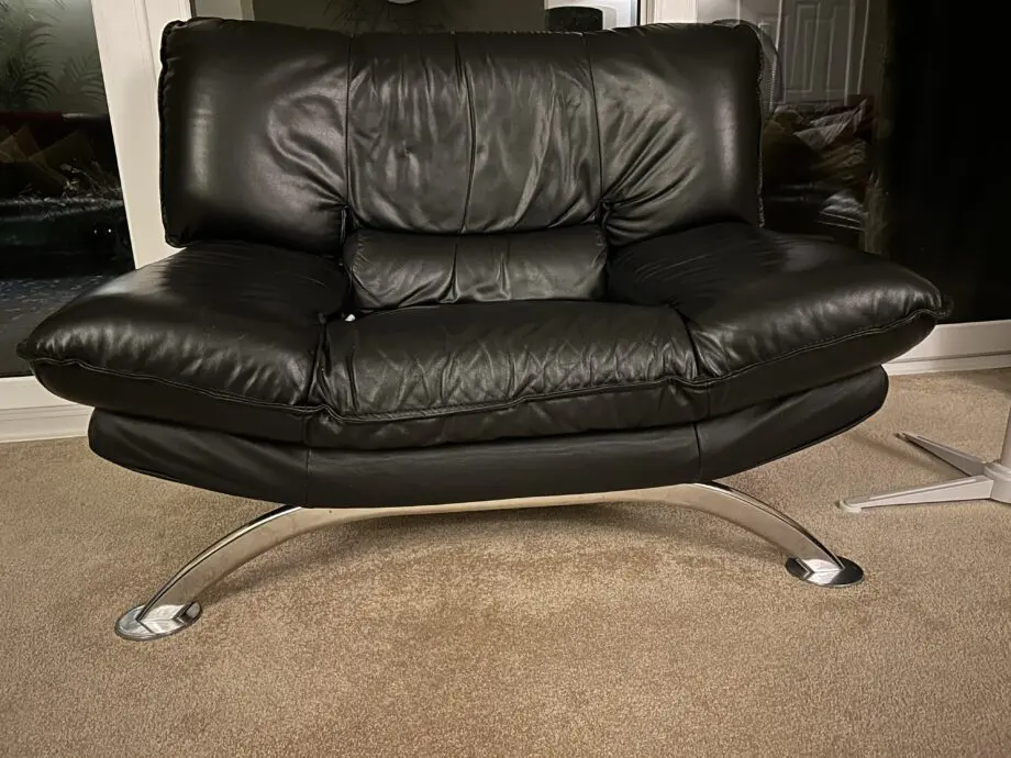 DFS Vintage Nicoletti Italian stylish chair Black leather with curved chrome legs