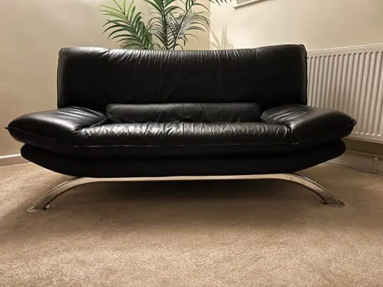 DFS Vintage Nicoletti Italian stylish sofa Black leather with curved chrome legs