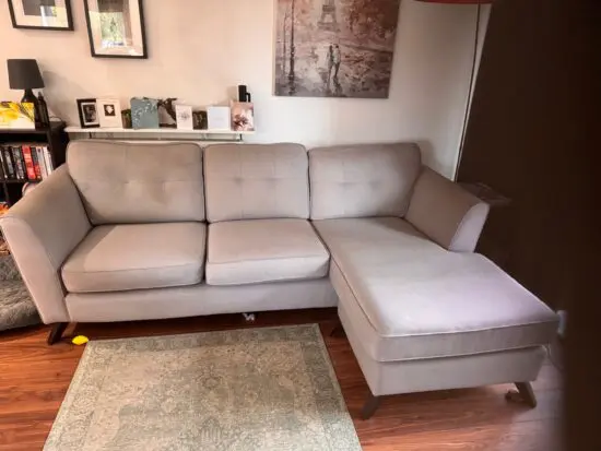A grey 3 seater corner sofa