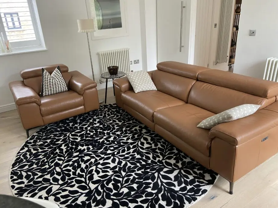 Leather reclining three seater sofa and chair