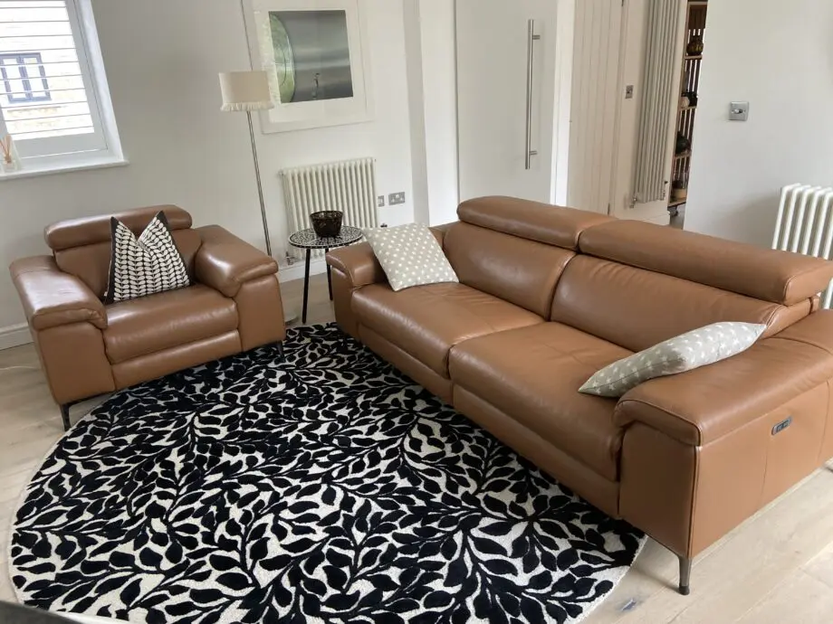 Leather reclining three seater sofa and chair