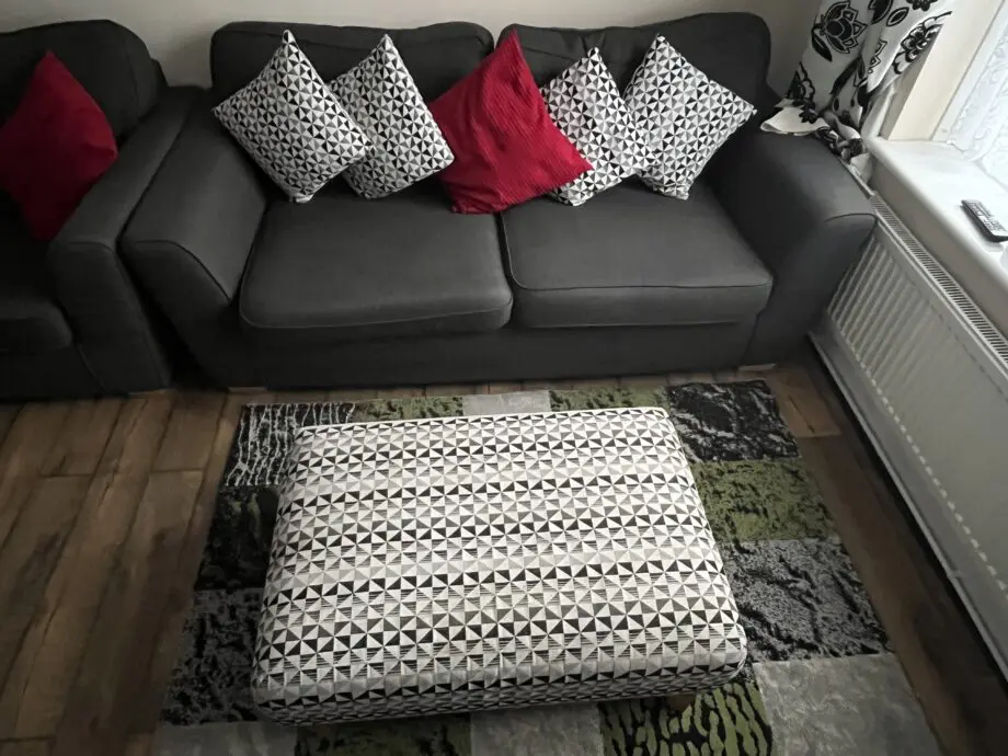 DFS charcoal sofa, two sofa chair and a footstool.