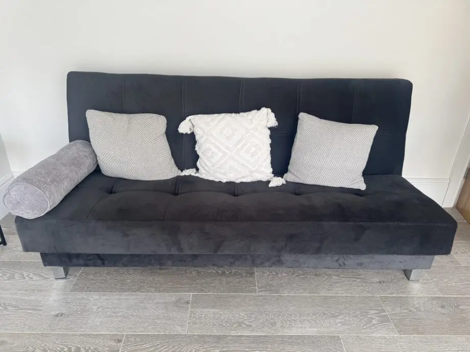 Grey sofa bed with silver feet