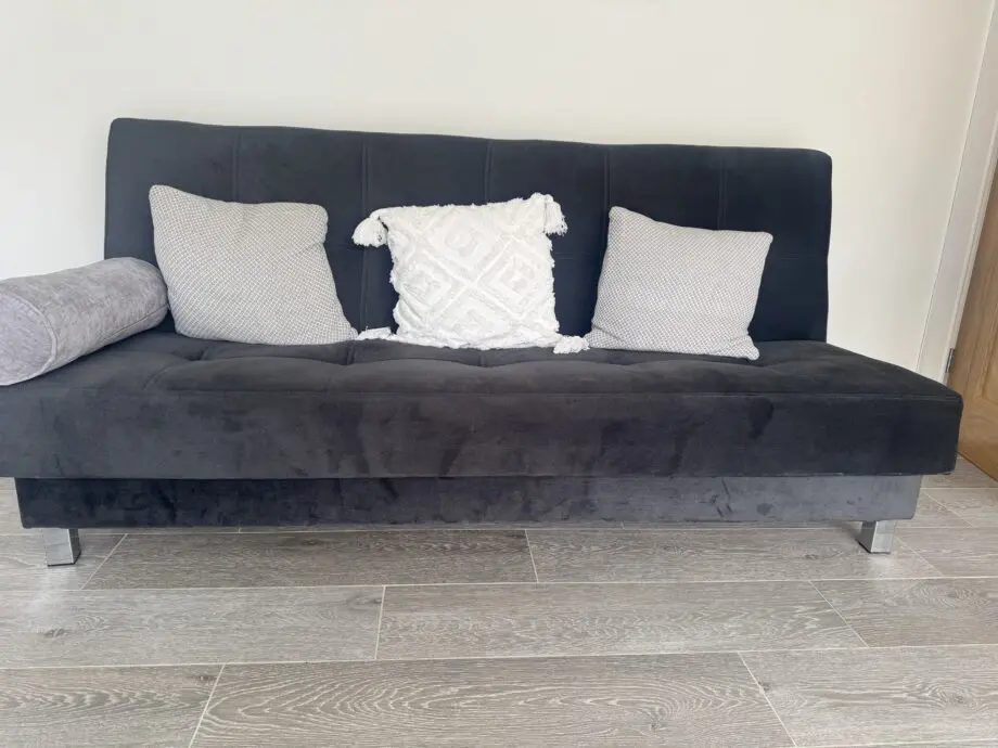 Grey sofa bed with silver feet
