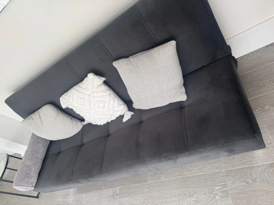 Grey sofa bed with silver feet