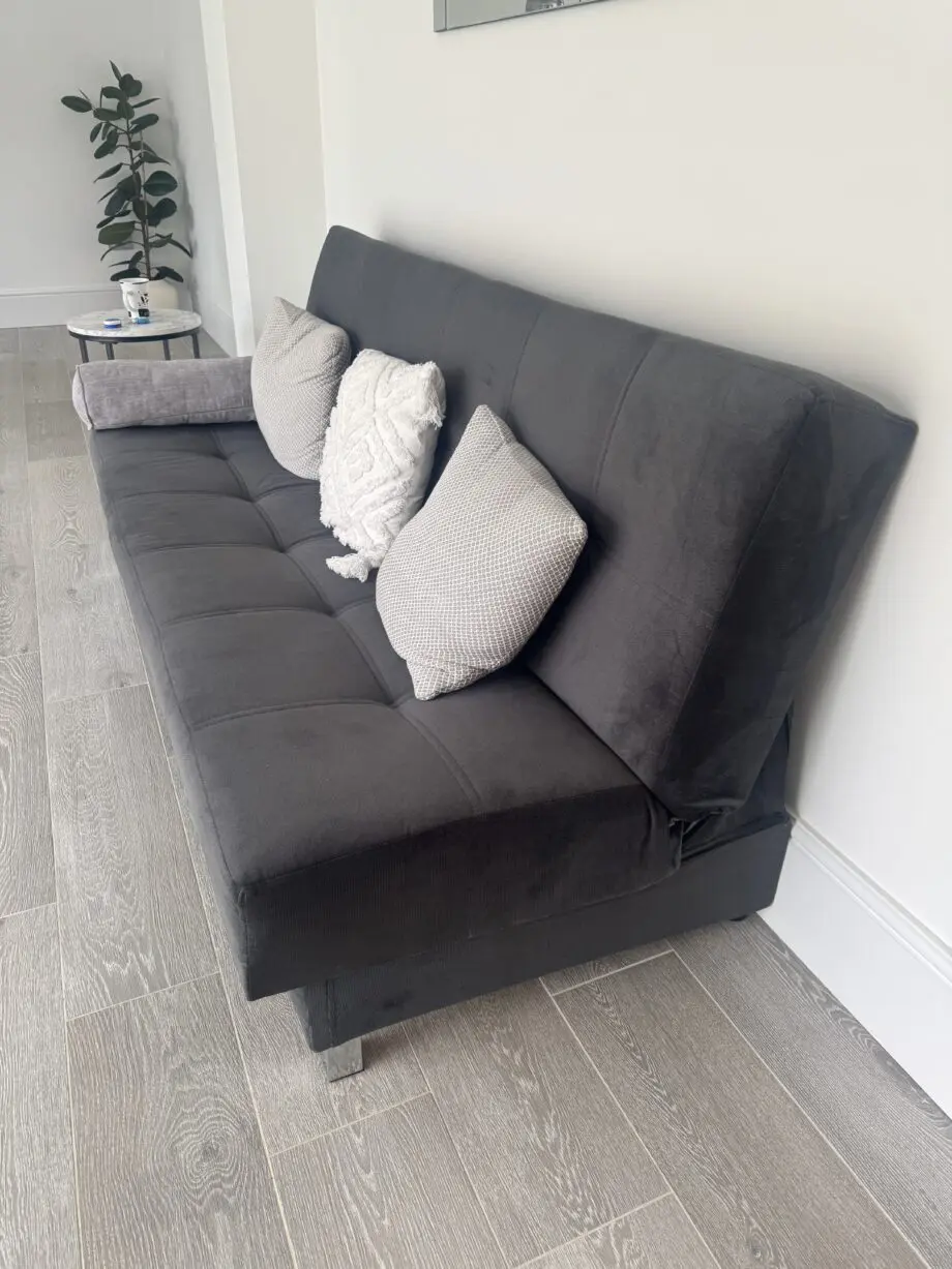 Grey sofa bed with silver feet