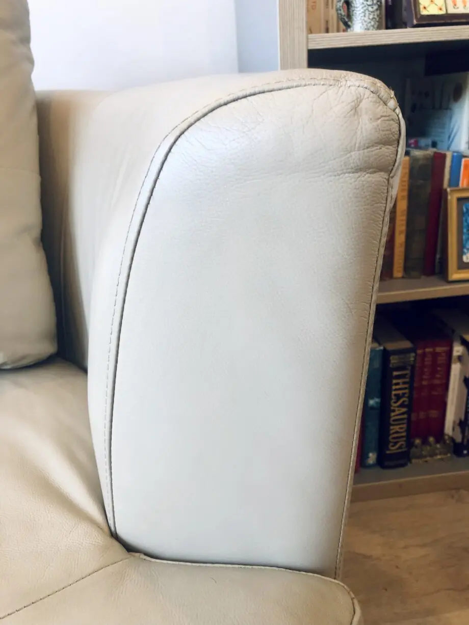 Beige leather swivel cuddle chair love seat round