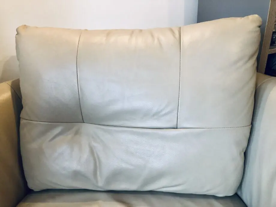 Beige leather swivel cuddle chair love seat round