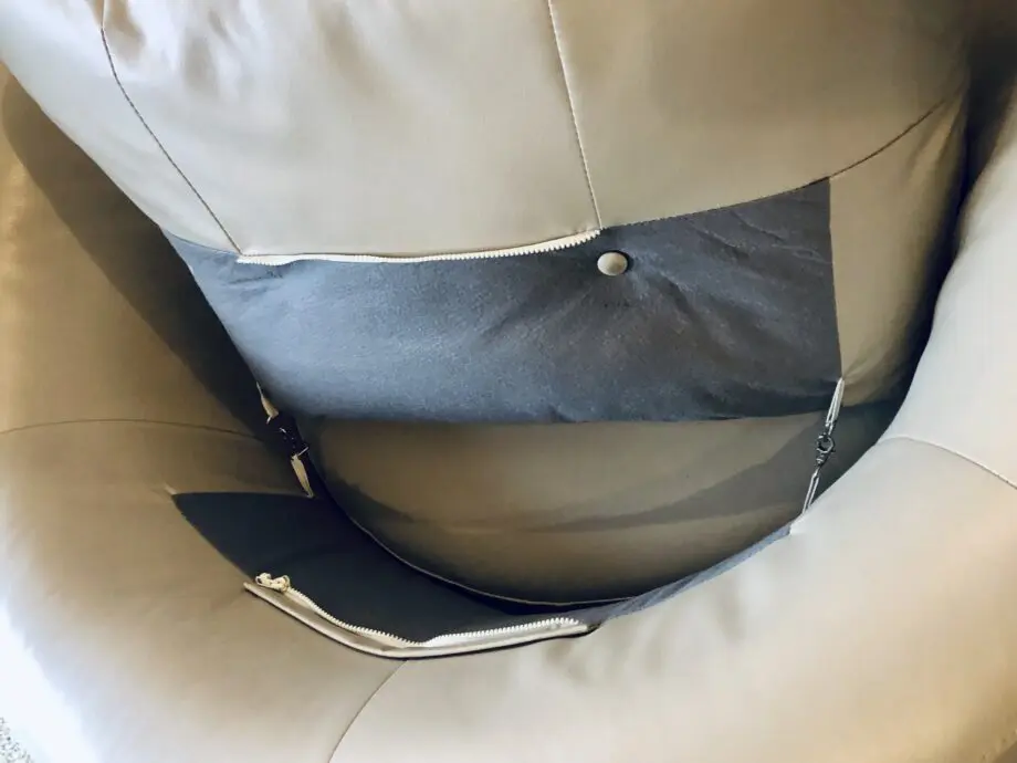 Beige leather swivel cuddle chair love seat round
