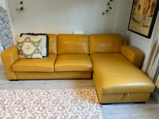 DFS corner yellow sofa with pull out bed and storage
