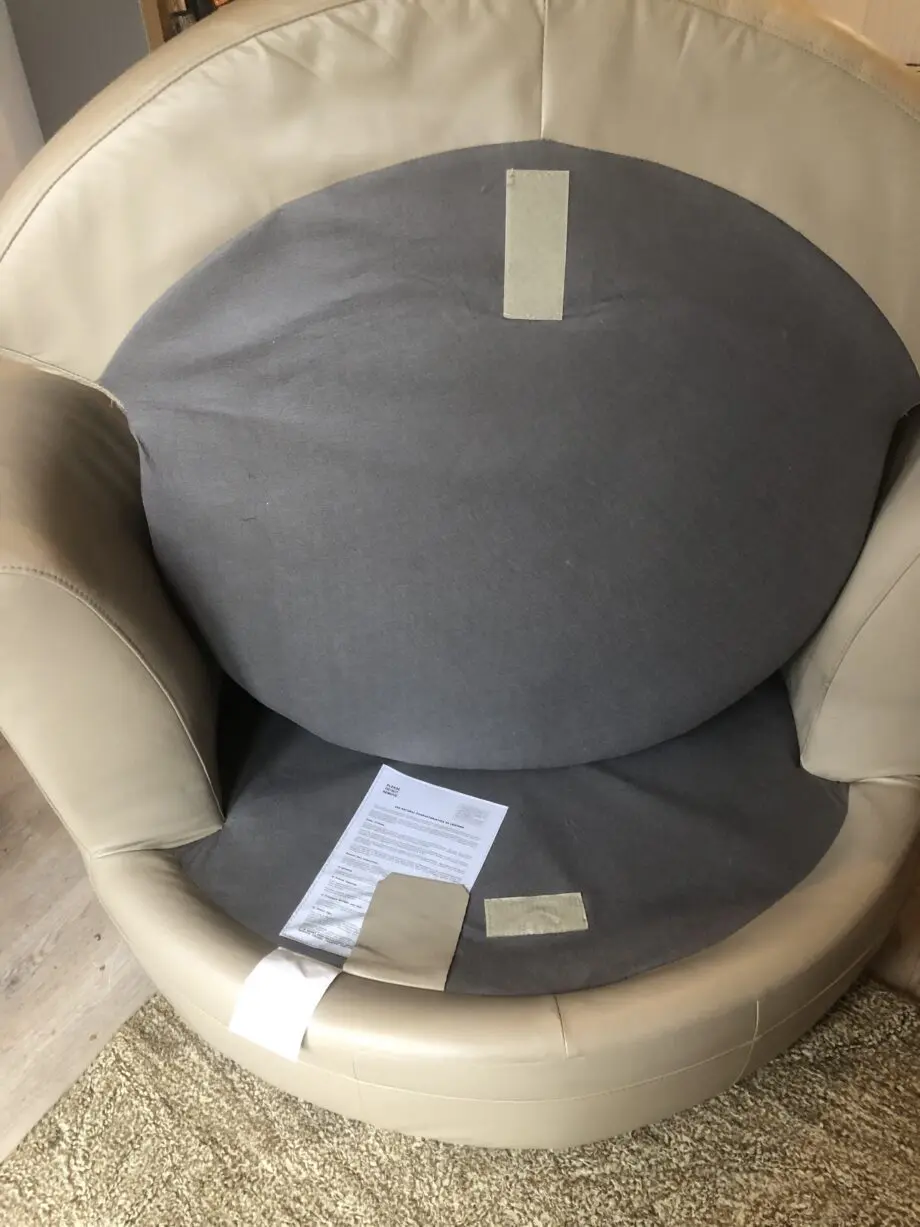Beige leather swivel cuddle chair love seat round