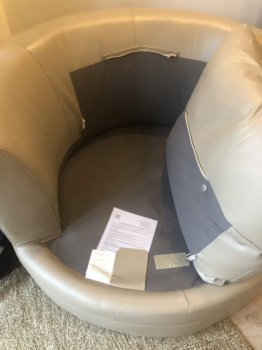 Beige leather swivel cuddle chair love seat round