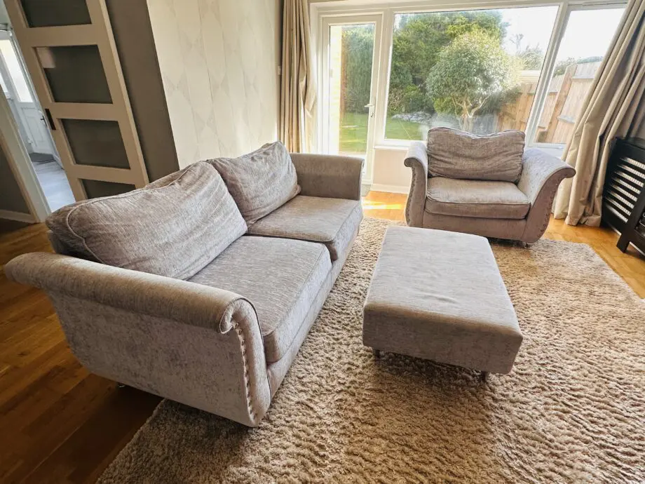 Grey 3 seaters and 1 seater sofa and 1 footstool