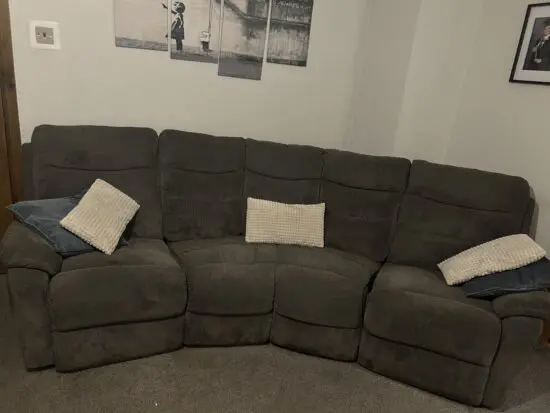 Grey curved recliner