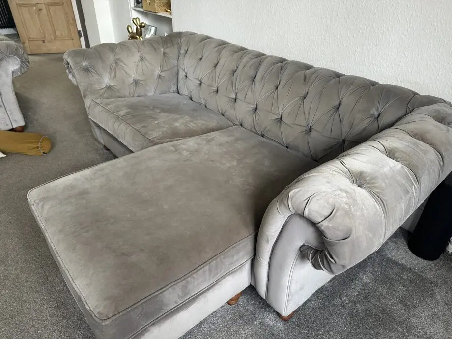 2 grey velvet Chesterfield sofas 1 with Chaise
