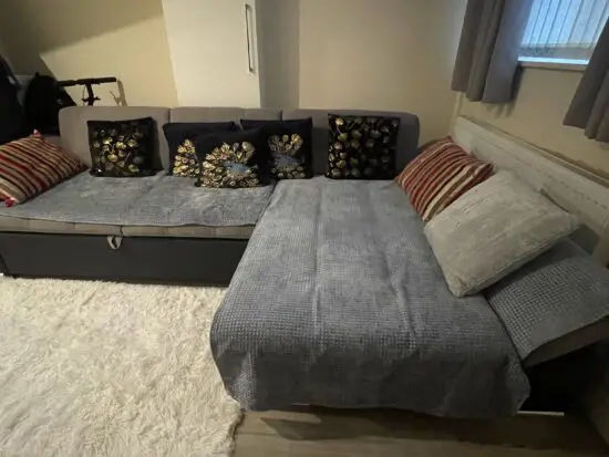 Black/Grey Right hand facing corner Sofa with storage