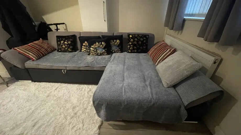 Black/Grey Right hand facing corner Sofa with storage