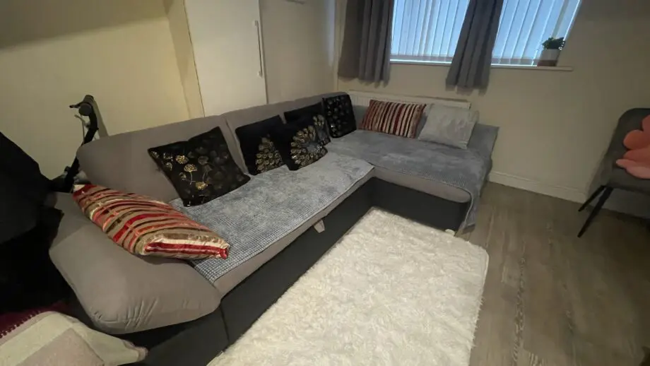 Black/Grey Right hand facing corner Sofa with storage