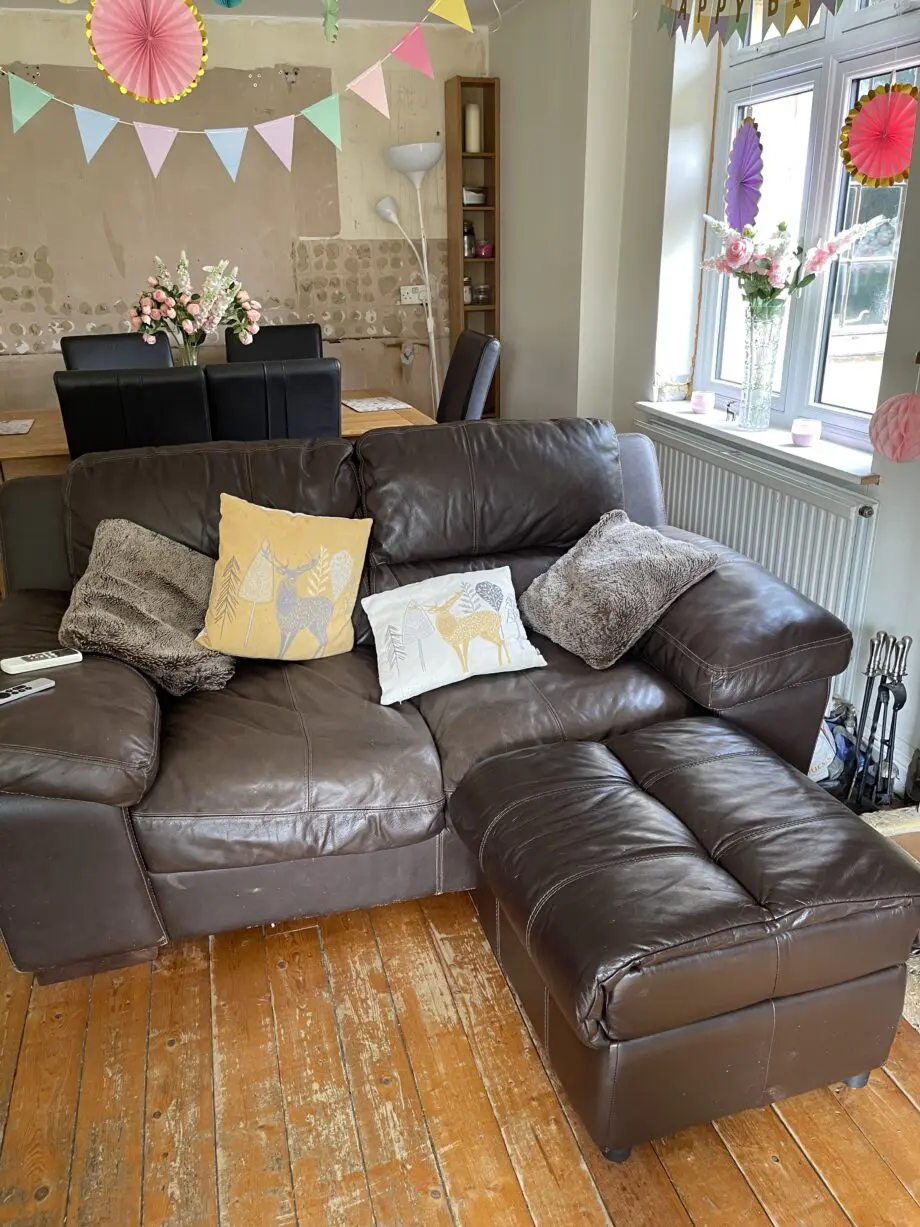 Brown leather sofas and poufees