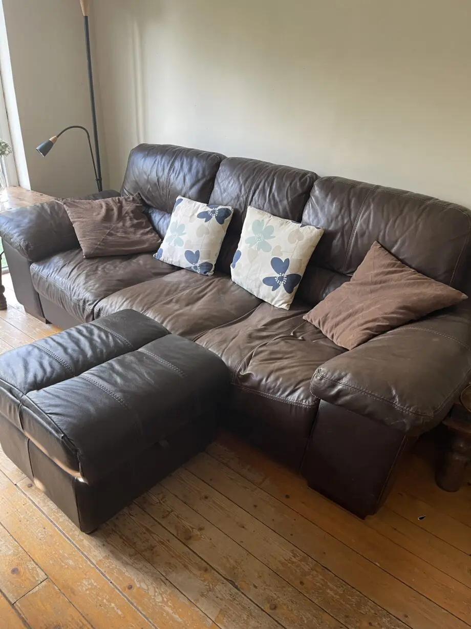 Brown leather sofas and poufees