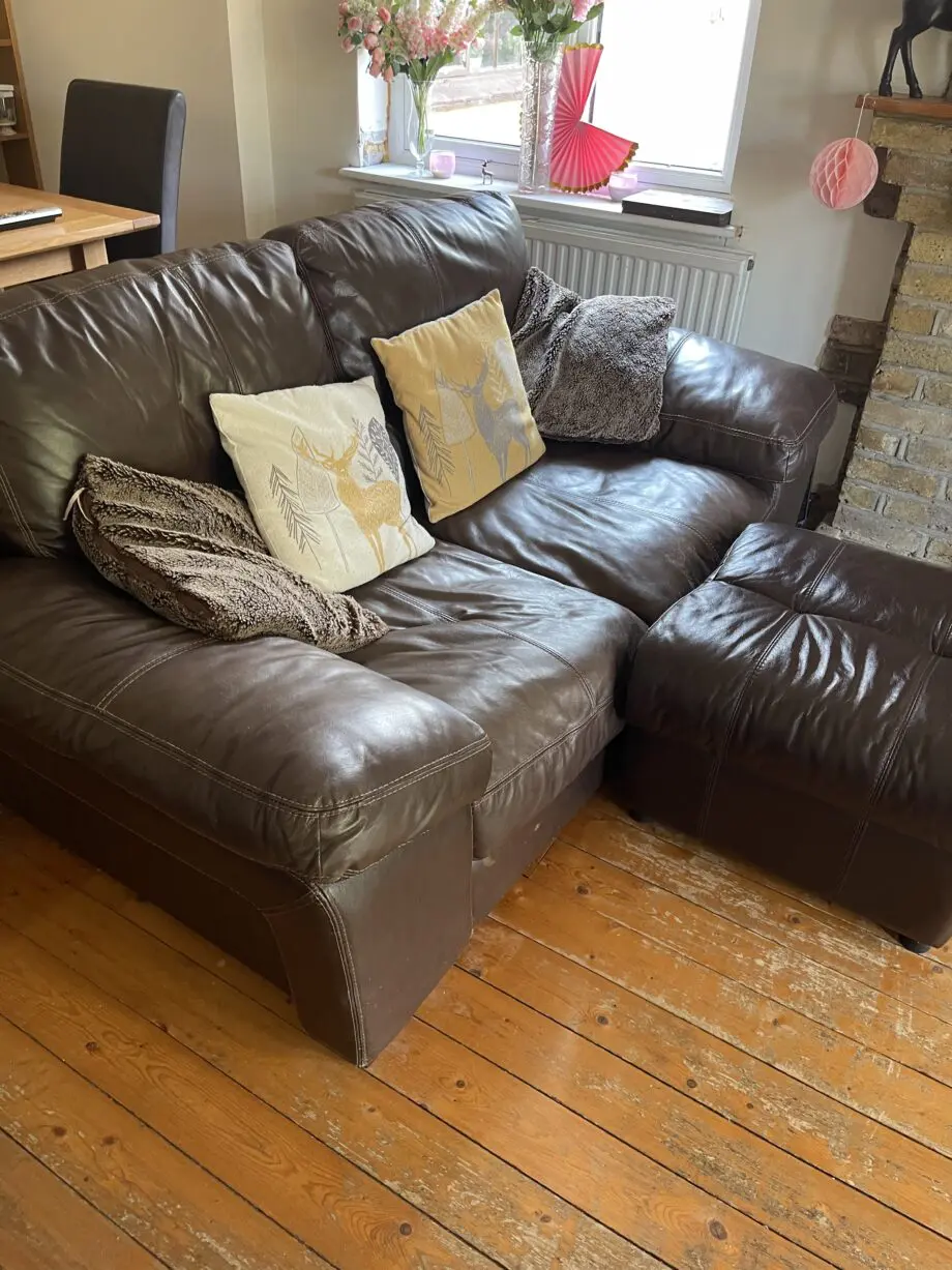 Brown leather sofas and poufees