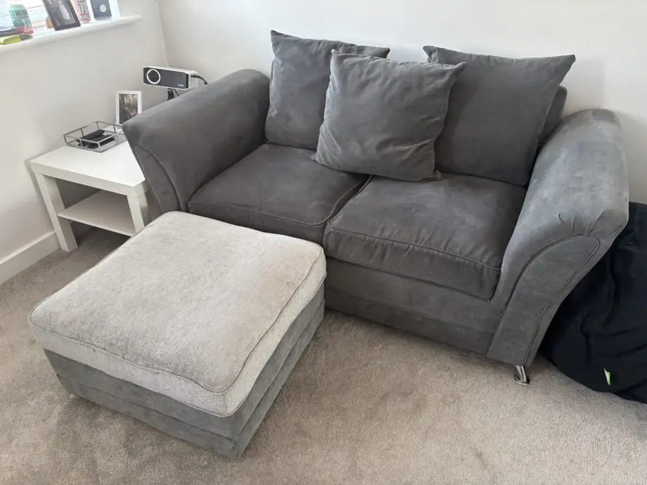 2 x Grey 2 seater scatter back sofas & fooststool