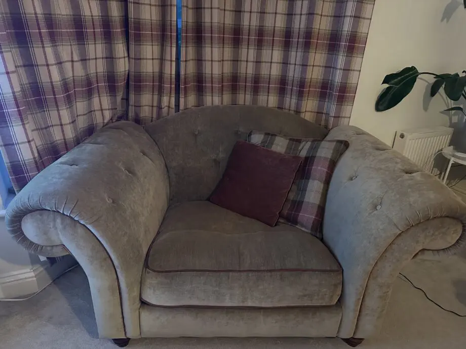 Olive green sofas with coordinating cushions