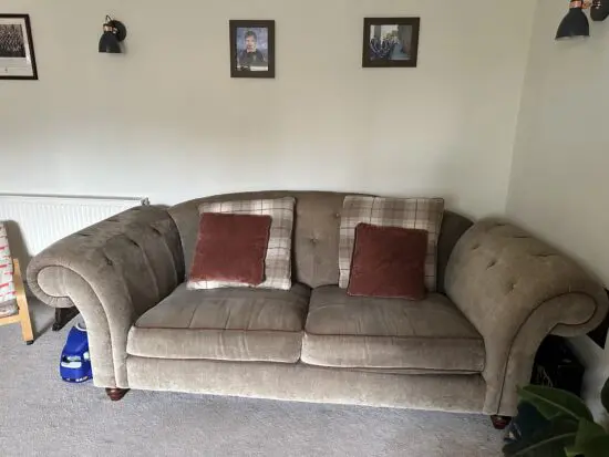 Olive green sofas with coordinating cushions