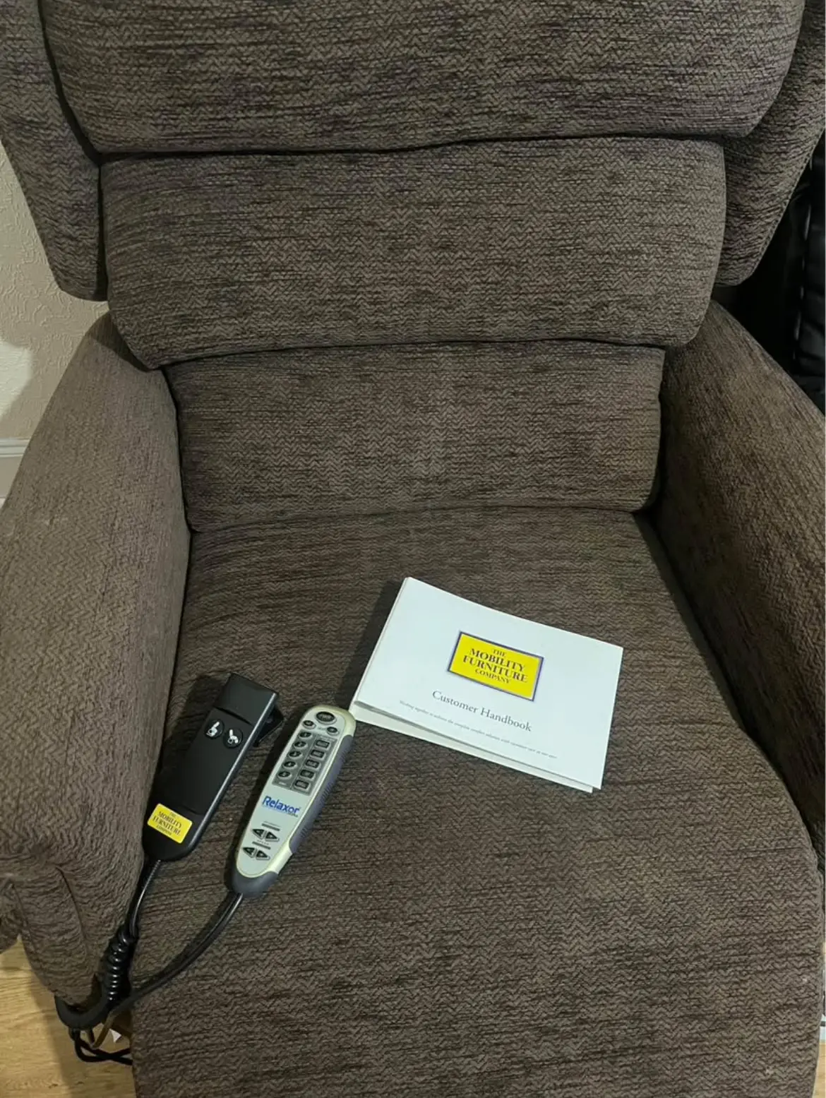 Brown electric heat and massage arm chair with lifting assist