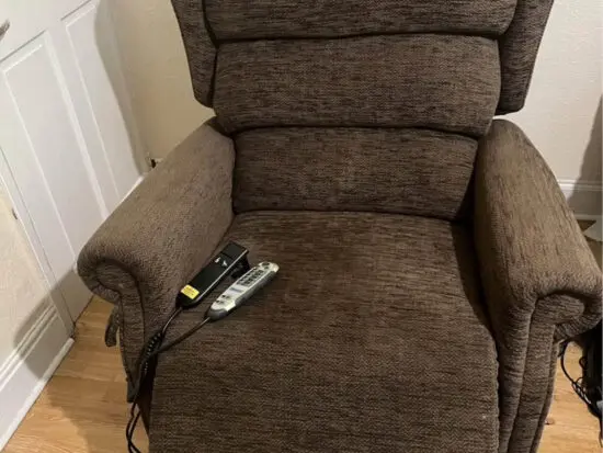 Brown electric heat and massage arm chair with lifting assist