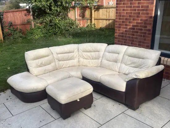 CREAM/BROWN LEATHER CORNER SOFA AND FOOTSTOOL