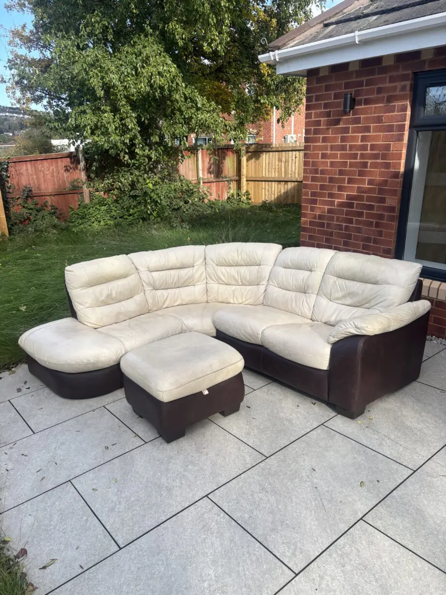 CREAM/BROWN LEATHER CORNER SOFA AND FOOTSTOOL
