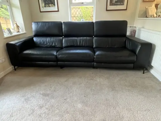 Large reclining 3 seater black leather sofa