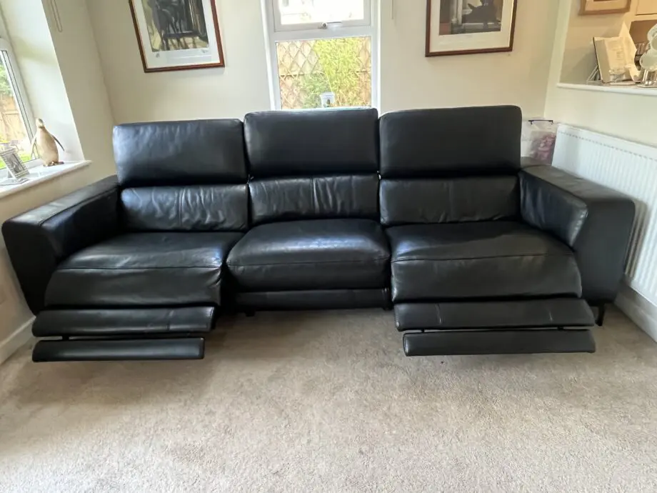 Large reclining 3 seater black leather sofa