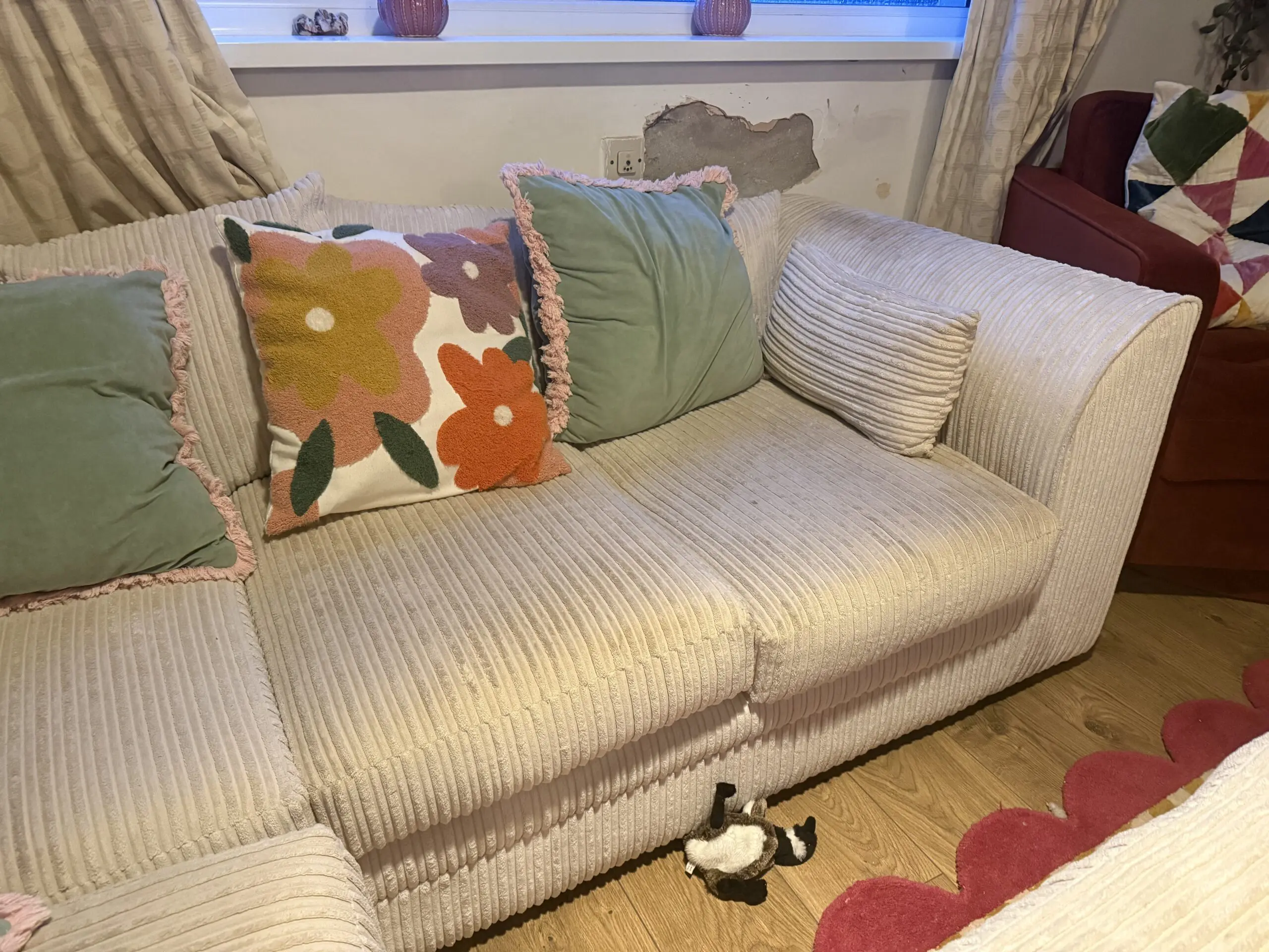 Cream corner sofa with matching footstool
