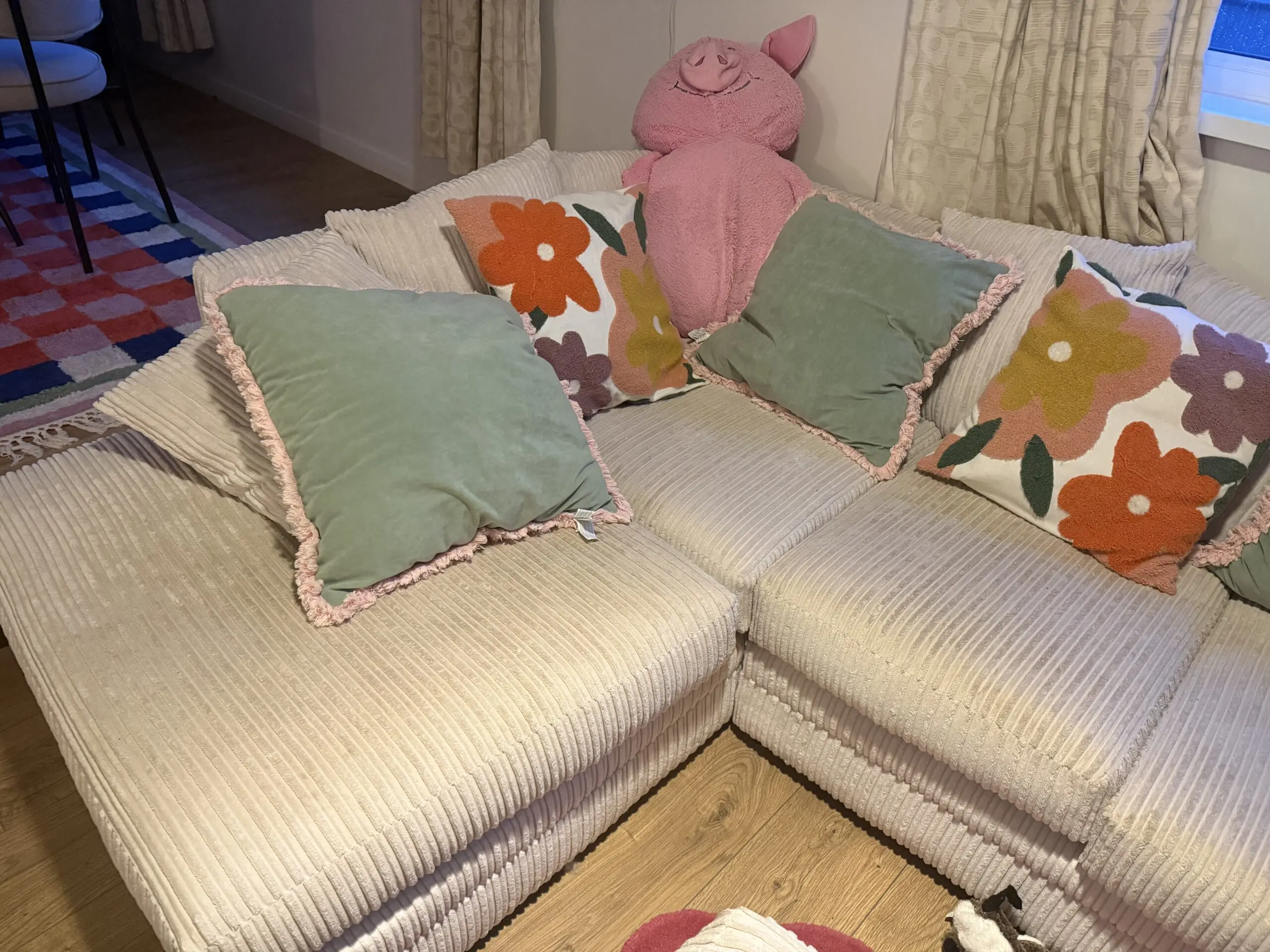 Cream corner sofa with matching footstool