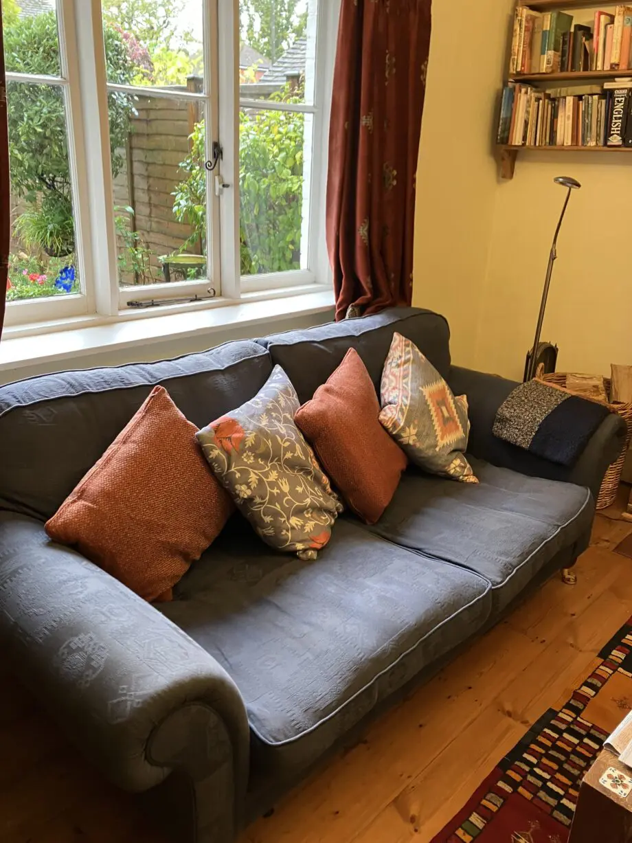 Blue sofa. Extra cushions not included.