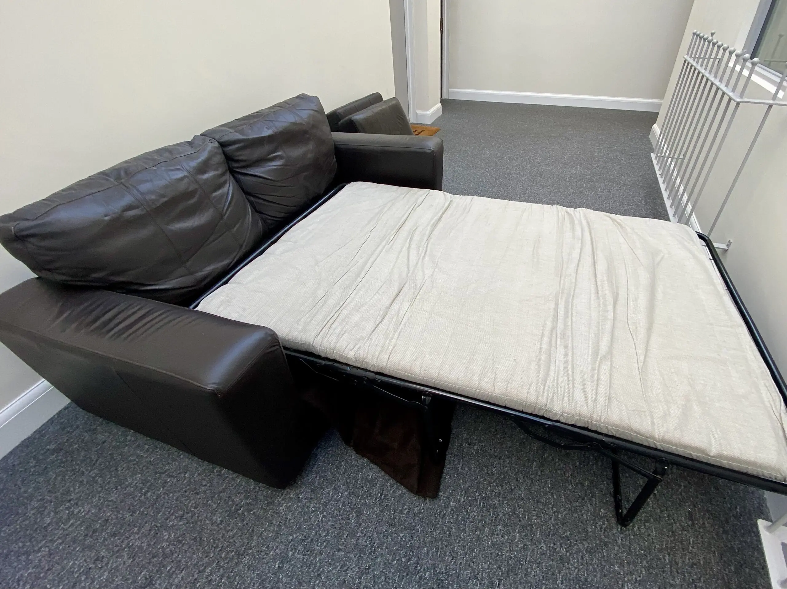 Leather brown 2 seater sofa bed