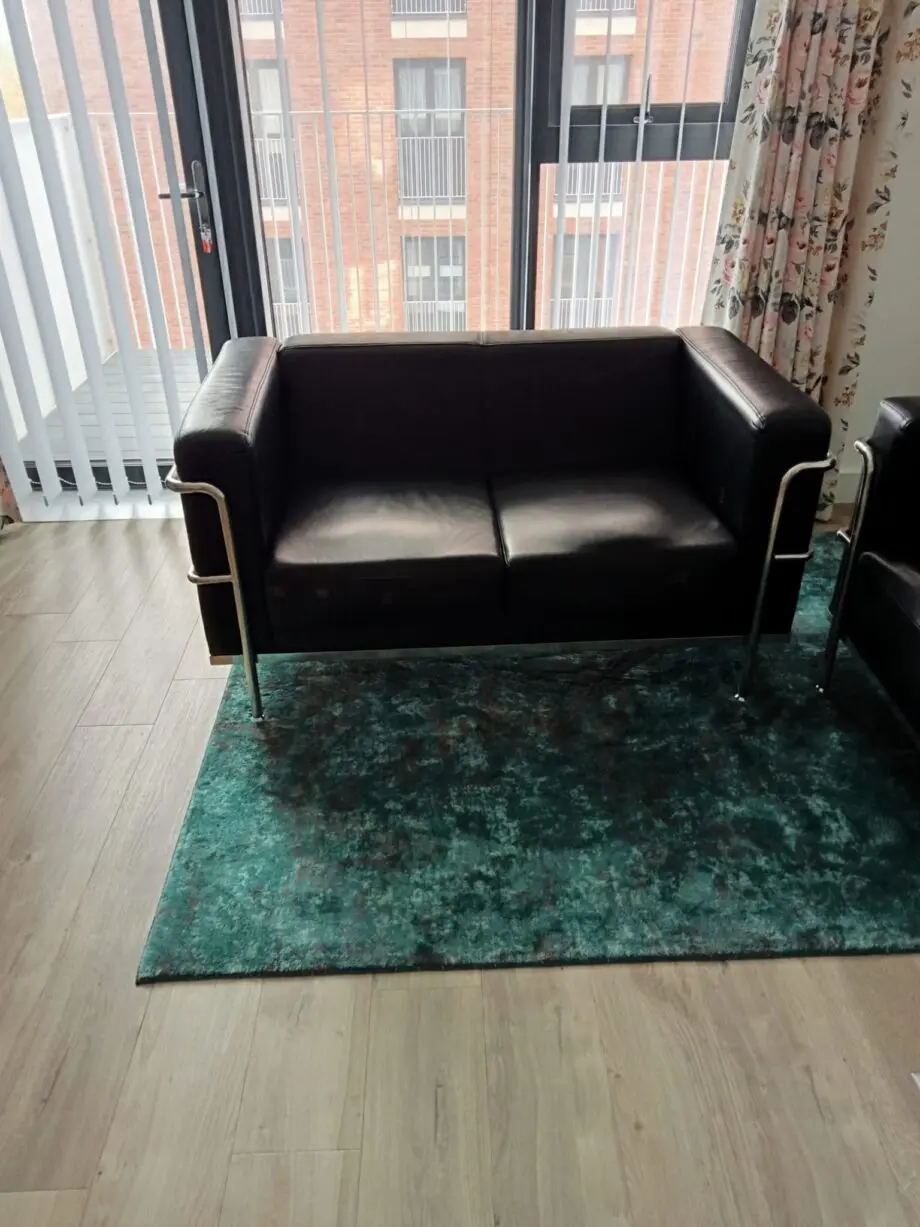 2 seater black leather sofa