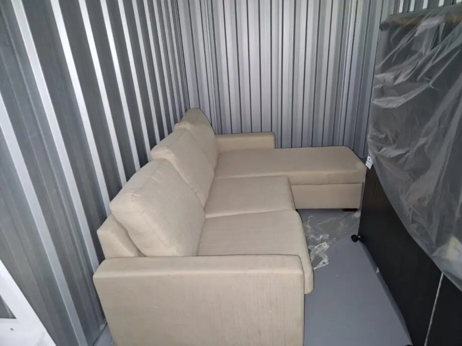 Dunelm Oat 3 seater-sofa bed with storage foot stool.