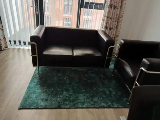 2 seater black leather sofa