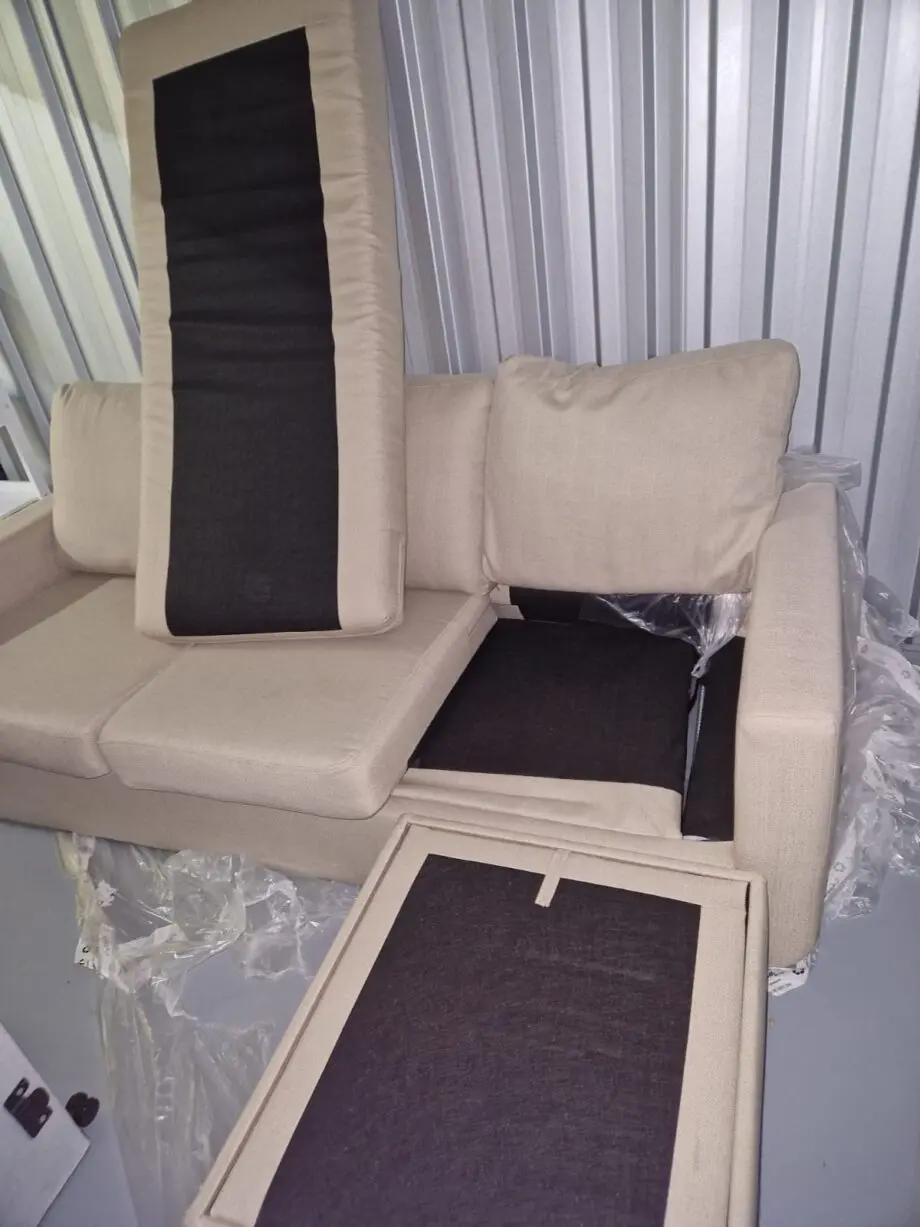 Dunelm Oat 3 seater-sofa bed with storage foot stool.