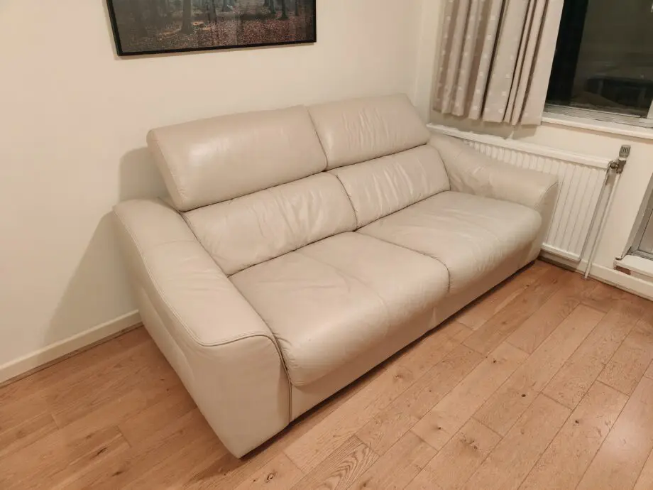 Good quality two seater creme leather sofabed