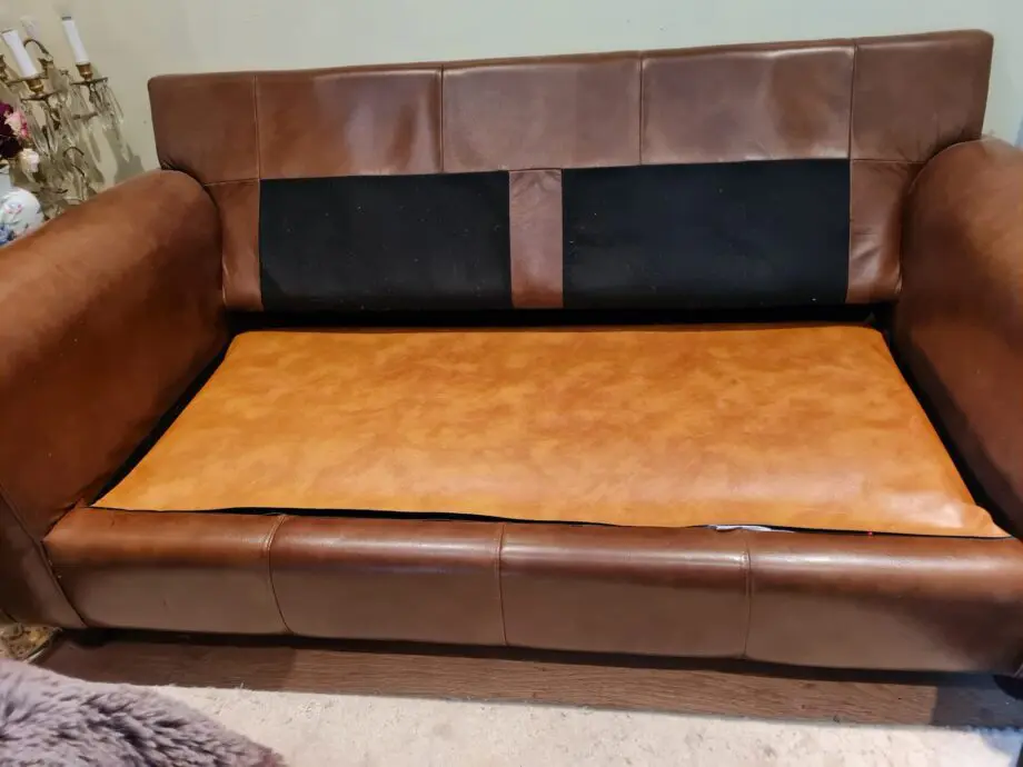 Brown leather 2 seater sofa bed