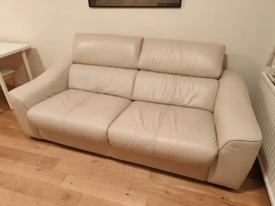Good quality two seater creme leather sofabed