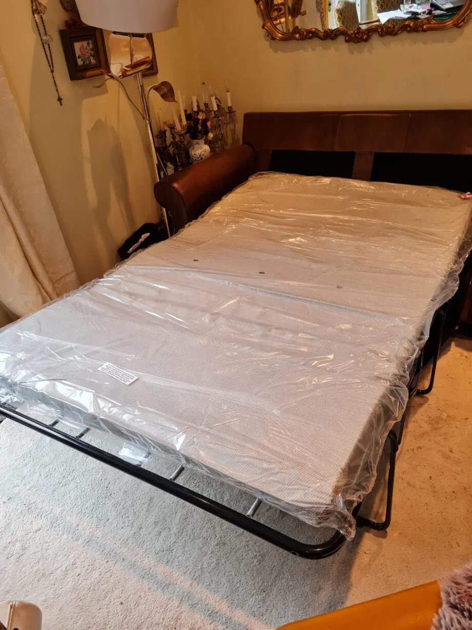 Brown leather 2 seater sofa bed